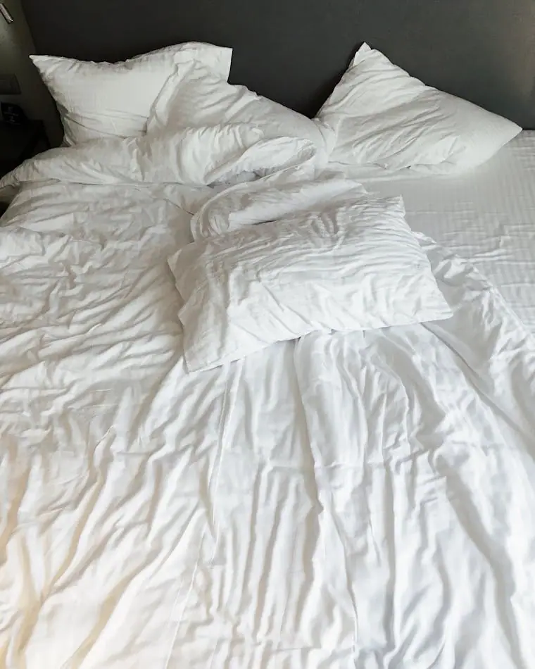 White pillows and bedding made up for arrival