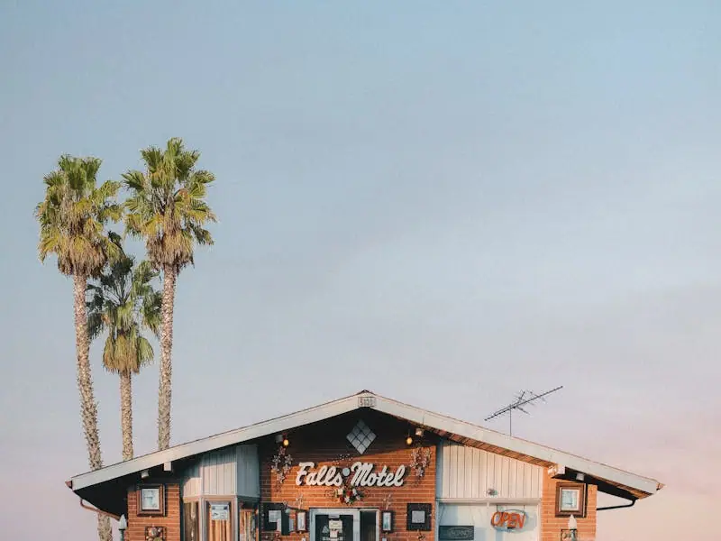 The Palms, a wood-clad retreat beside palm trees